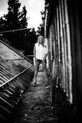 sexy girl standing near old grungy building