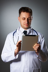 Medical doctor with tablet pc portrait