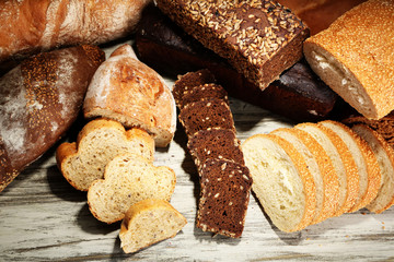 Much bread on wooden board