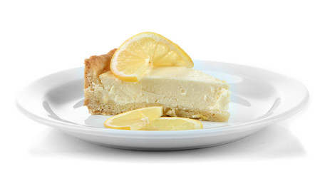 Slice of  lemon cheesecake on plate, isolated on white
