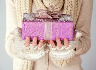 Female hands with gift box, close-up