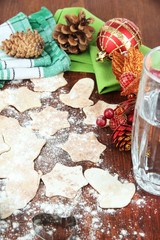 Making Christmas cookies on wooden table