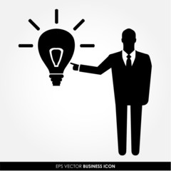 Businessman pointing to the light bulb