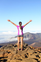 Success and achievement - hiking woman on top