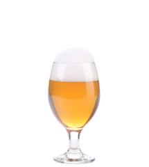Closeup of beer glass with foam.
