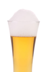 Closeup of beer glass with foam.