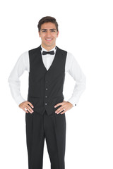 Attractive young waiter posing smiling at camera