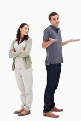 Fototapeta premium Man is standing back to back with angry partner