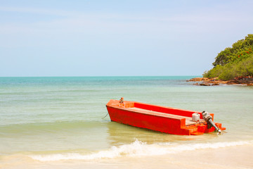 Orange boat at a beach