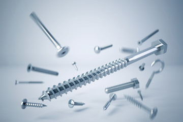 various types of screws and bolts caught in drop - obrazy, fototapety, plakaty