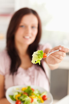 Woman showing salad