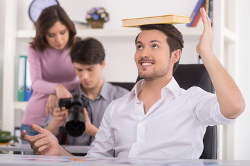 Man at foreground is making fun.