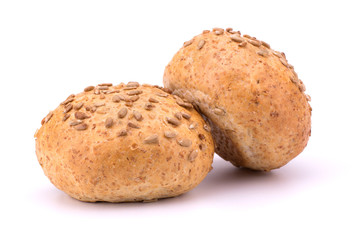 Round sandwich bun with sunflower seeds isolated on white backgr
