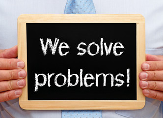 We solve problems chalkboard with businessman