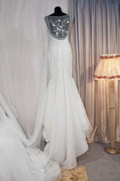 Beautiful wedding dress on a mannequin in a bridal shop