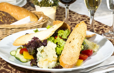 salad of meat cheese and vegetables in a restaurant