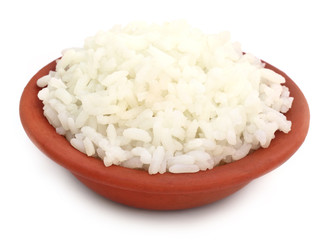 Fresh rice on a brown bowl over white background