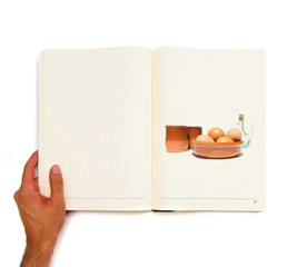 Ingredients to cook printed on white book