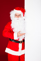 Portrait of a santa holding blank placard