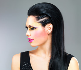 Profile portrait of a woman with fashion makeup