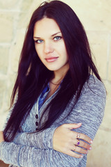  young brunette woman with long beautiful hair close-up   