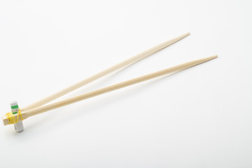 Bamboo chopsticks on white background
