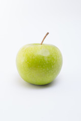 Single green apple on white background