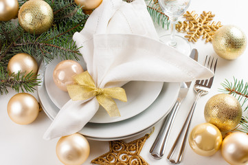 Fototapeta na wymiar Christmas table setting in gold tones