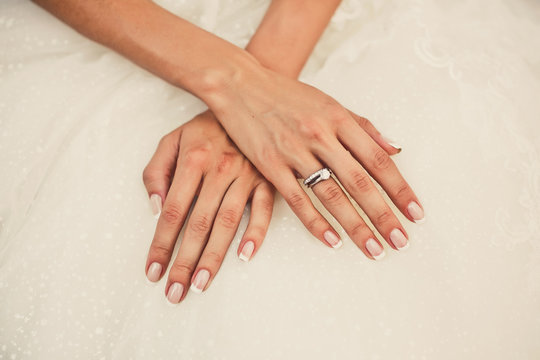 Bride's hands on a dreww