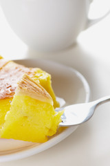 Cake and tea on white a