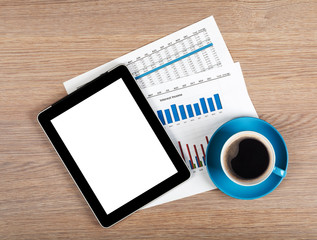 Tablet with blank screen and coffee cup