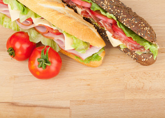 Fresh sandwiches with meat and vegetables and tomatoes