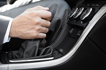 Hand of the driver of the car