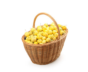 yellow apples in a wicker basket