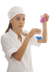 Woman chemist and chemicals in flasks