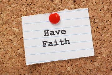 Have Faith on a paper note pinned to a cork notice board