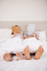 Fototapeta na wymiar Portrait of playful couple reading