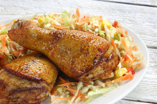 Fried chicken legs with vegetable salad