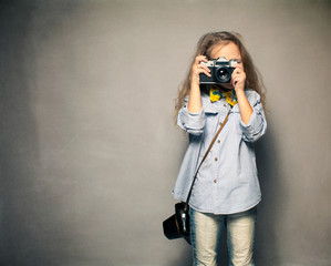 Child with camera.