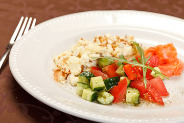 Scrambled eggs with salmon and vegetables