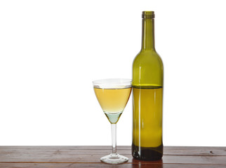 Bottle and a glass of white wine isolated over white