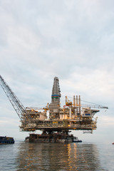 Fototapeta premium Oil rig being tugged in the sea