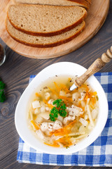 Bowl of chicken soup with vegetables and noodles