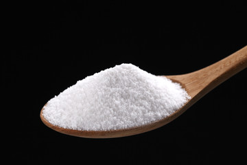 Fototapeta na wymiar Cukru lub soli na łyżkę