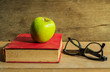 Antique book with apple