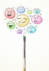 Smiley faces coming out of paintbrush