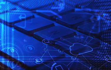 Keyboard with glowing cloud technology icons