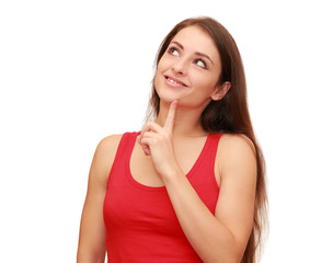 Beautiful thinking woman looking up with happy smile isolated on