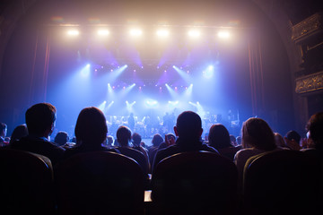 The audience at a concert on the background of the scene. - obrazy, fototapety, plakaty