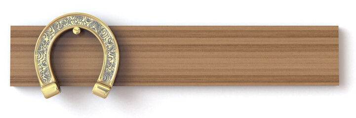 Golden horseshoe on a wooden board